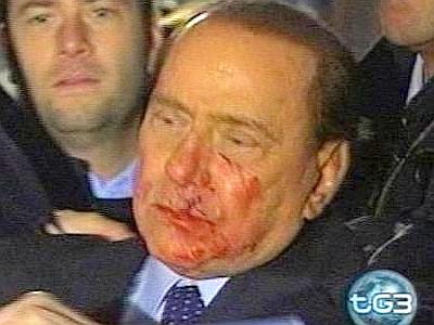 Berlusconi hit in the face